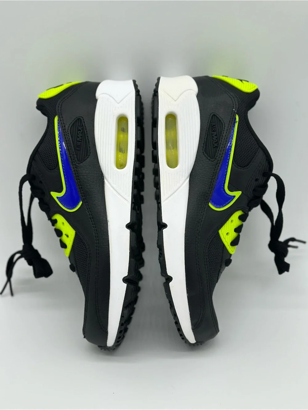 Nike Kids Black Sneakers with Neon Yellow and Blue Swoosh